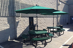 A sitting area covered with an umbrella at Fresno Truck Center